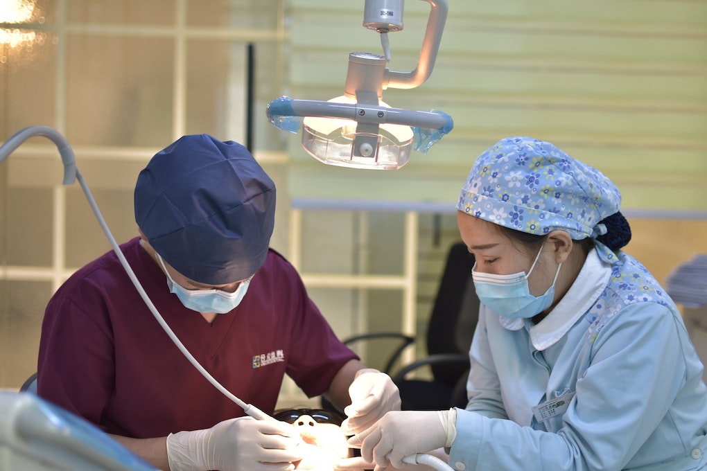 dentists working on patient