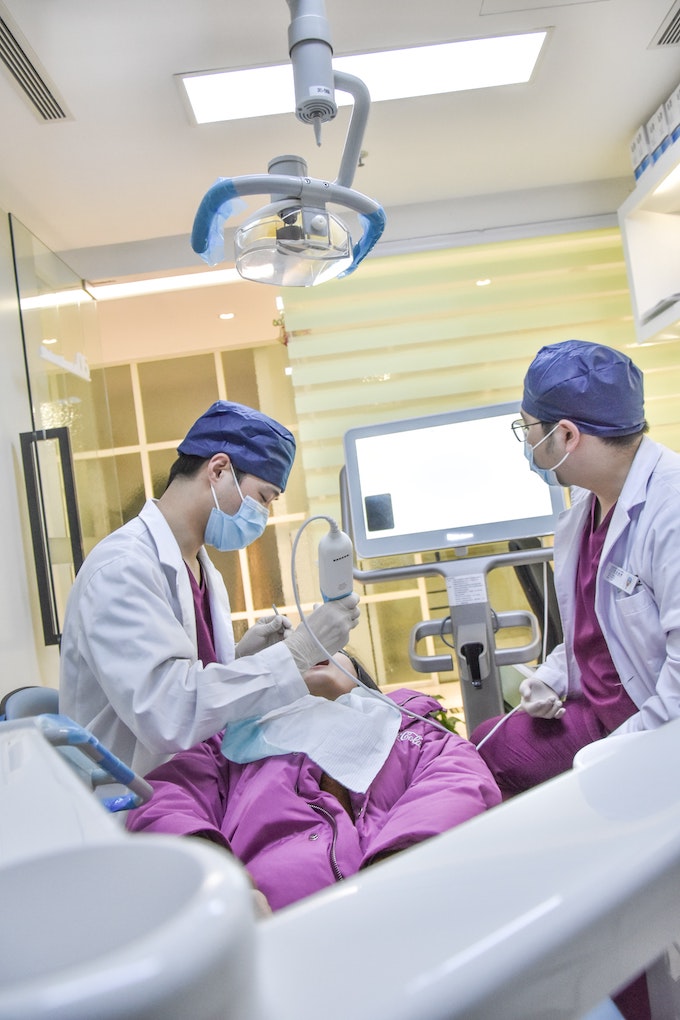 dentists working on patient