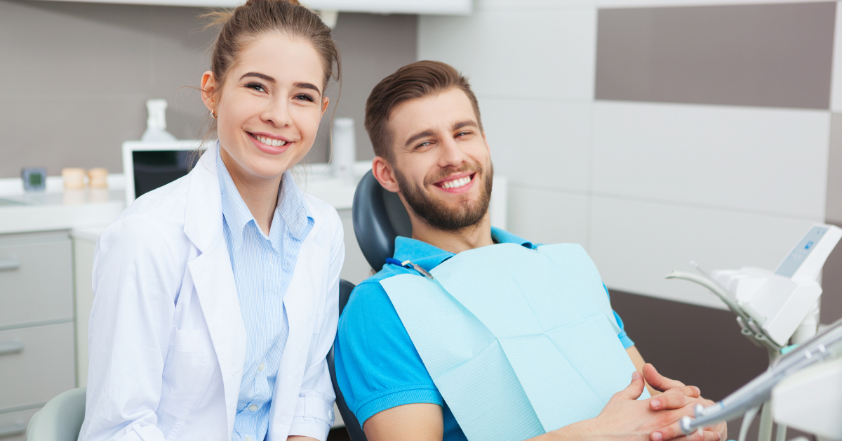 dentist and patient smiling