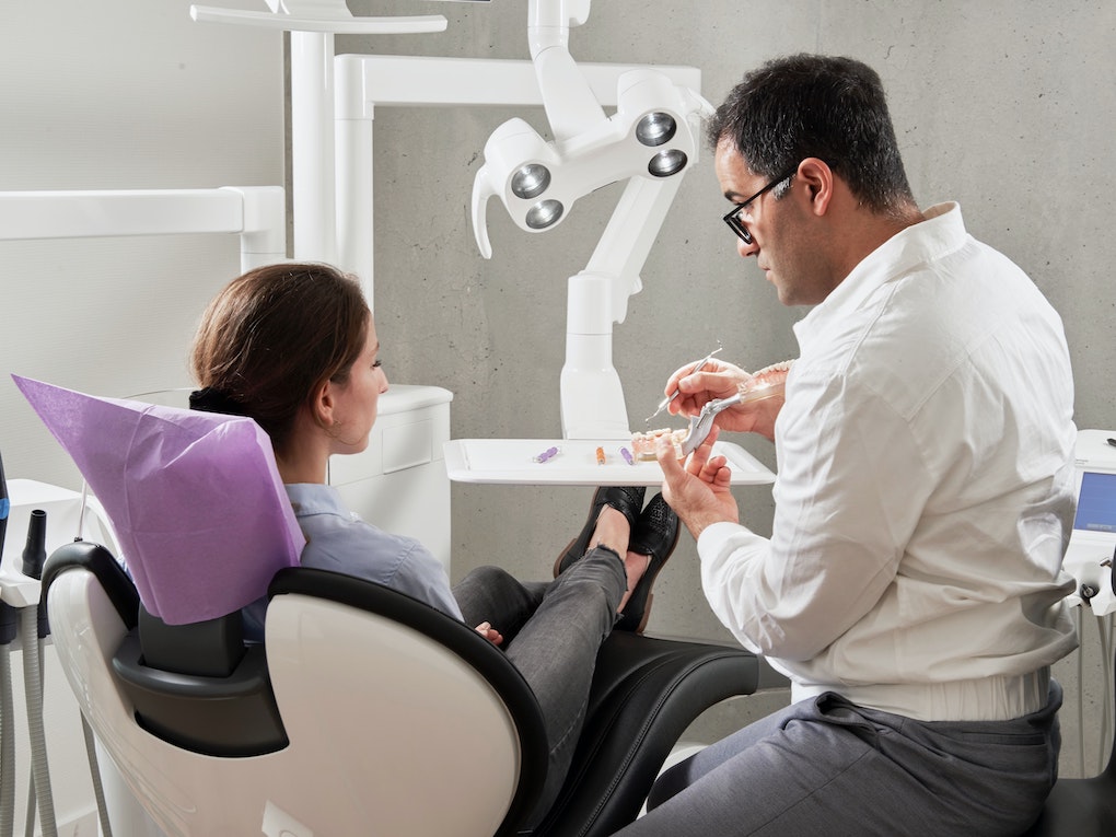 dentist talking to patient