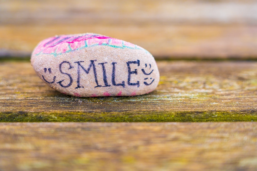 smile written on rock