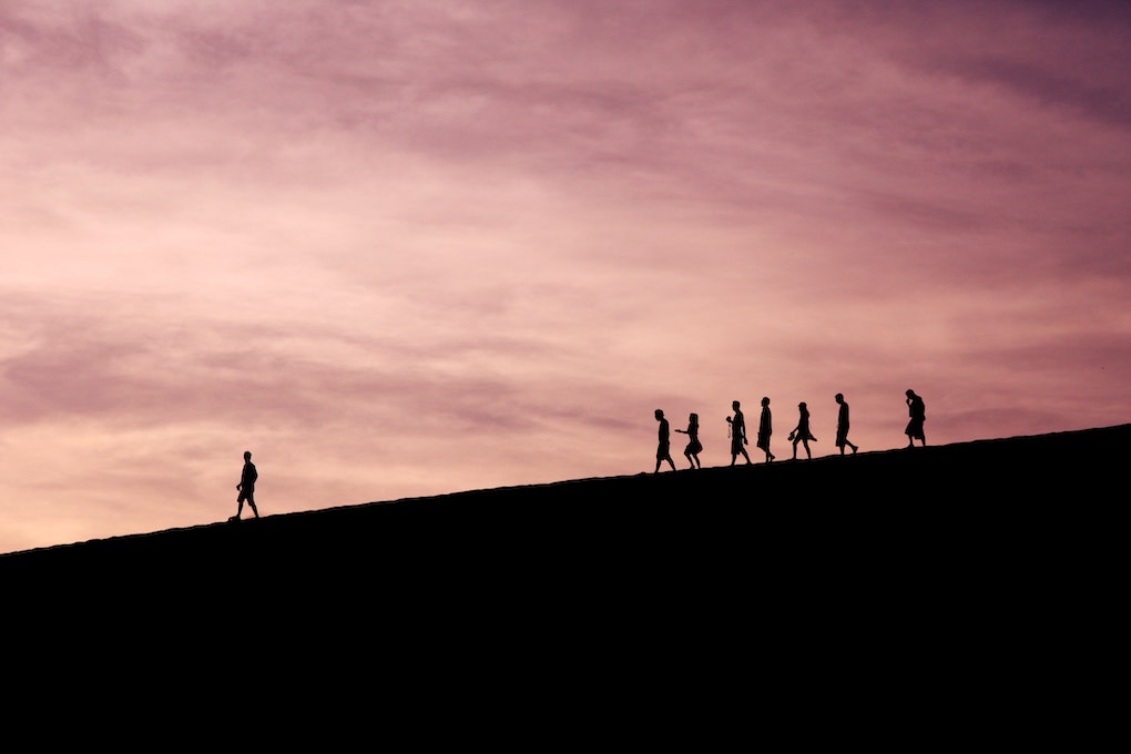 person leading hikers