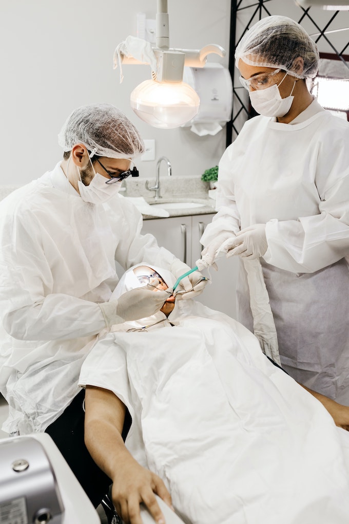 dentists working on patient
