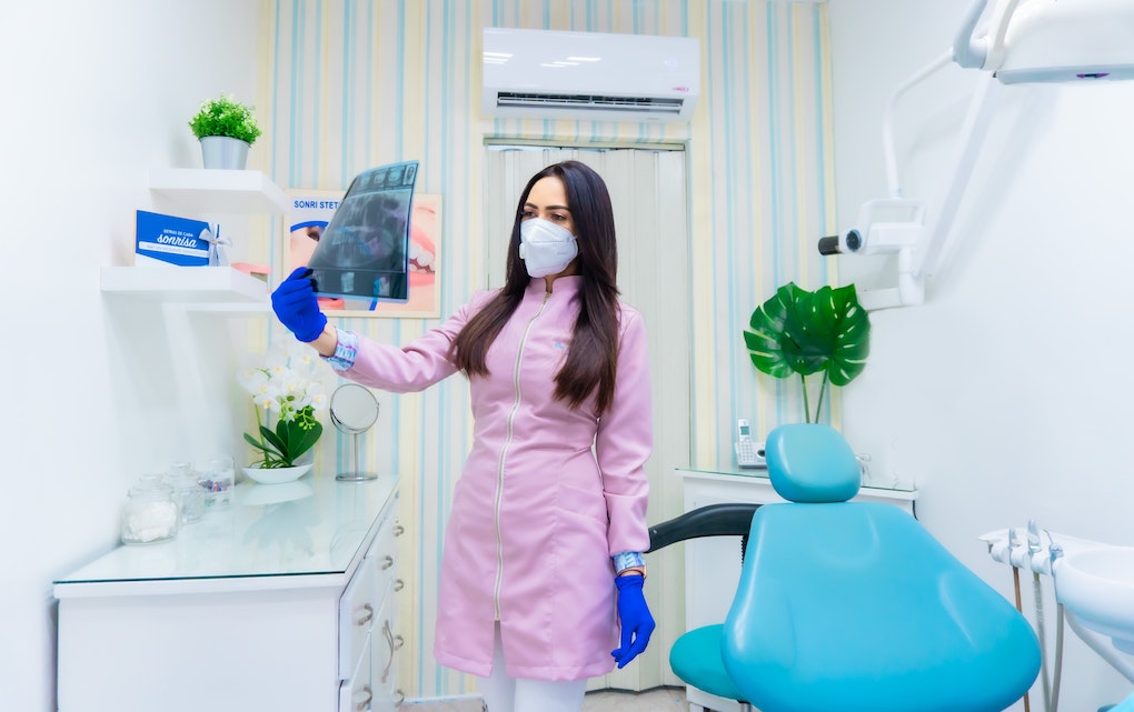 dentist looking at x-ray