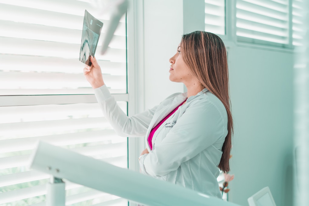 dentist looking at an x-ray