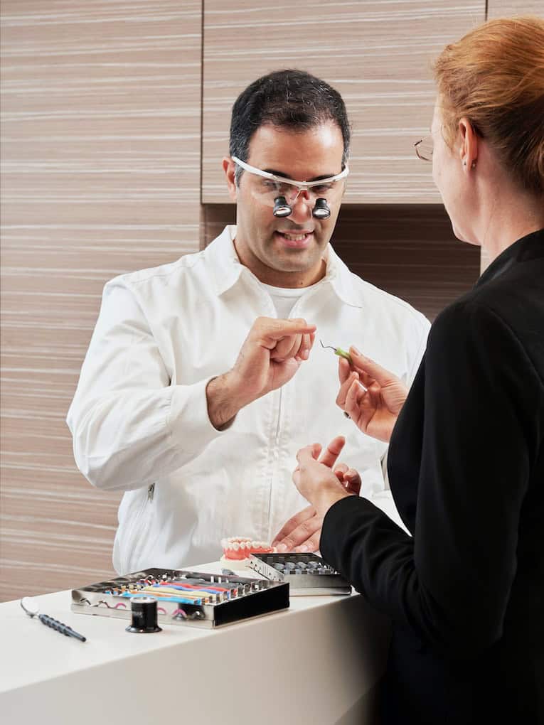 dentist talking to patient